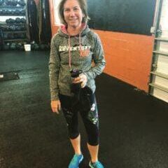 Member smiling after workout inside Manic Training gym Member smiling after workout inside Manic Training gym